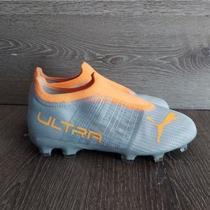 Puma Kids soccer cleats in Gray and Orange